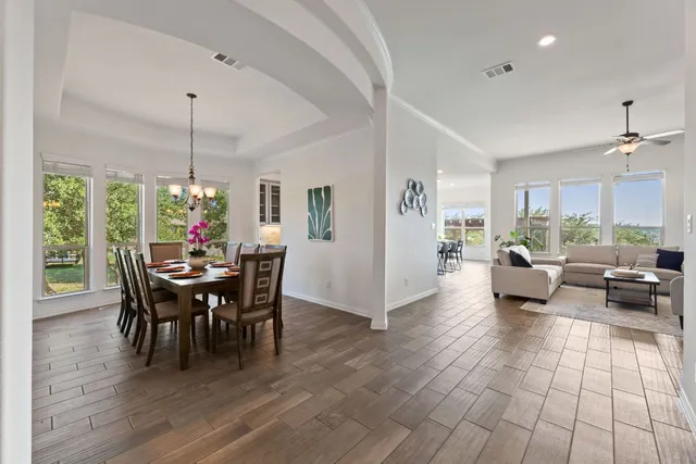 a view of a dining room with furniture window and wooden floor