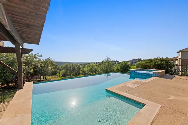 a view of swimming pool with a yard