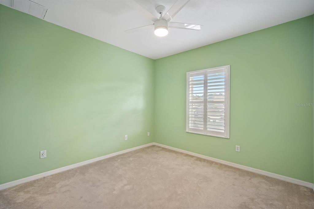 6142 Hadley Commons Drive Riverview, FL 33578 - Photo 13 of 29 an empty room with a window and a fan