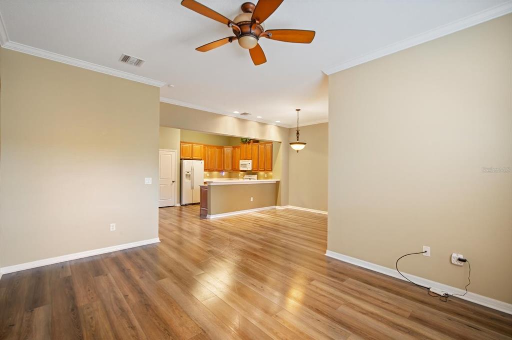 6142 Hadley Commons Drive Riverview, FL 33578 - Photo 9 of 29 a view of a kitchen with wooden floor a sink and a window