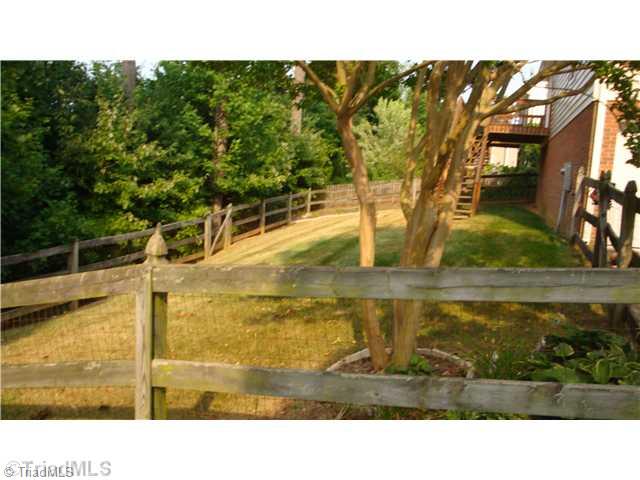 5080 Windsbury Ridge Road Clemmons, NC 27012 - Photo 15 of 16 Exterior Back. Fenced in Backyard