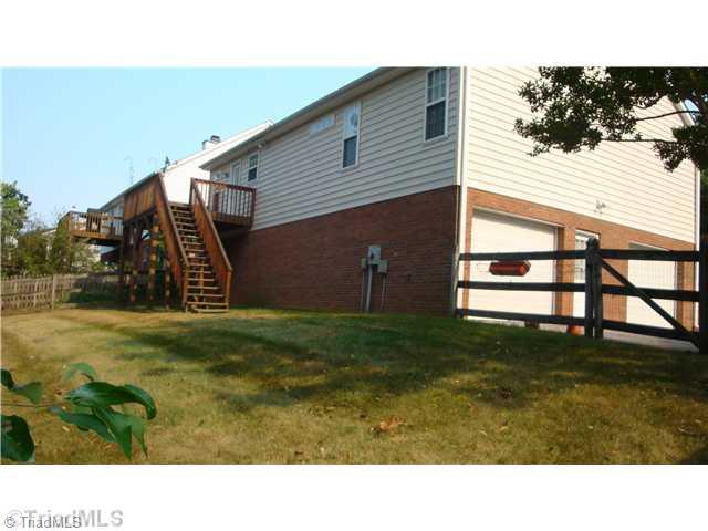 5080 Windsbury Ridge Road Clemmons, NC 27012 - Photo 16 of 16 Exterior Back. Rear Deck/ Backyard