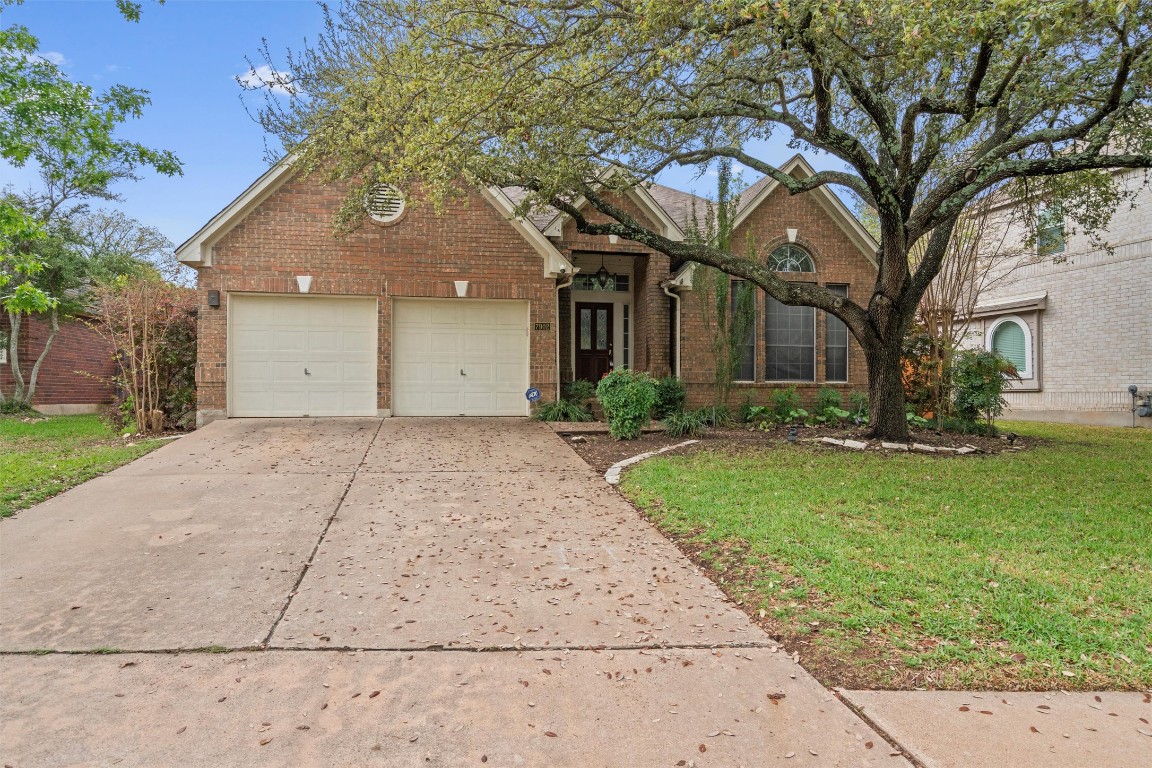 7902 Isaac Pryor Drive Austin, TX 78749 - Photo 1 of 1 a front view of a house with a yard and trees