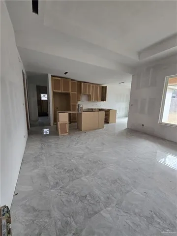 a view of a kitchen with furniture and window