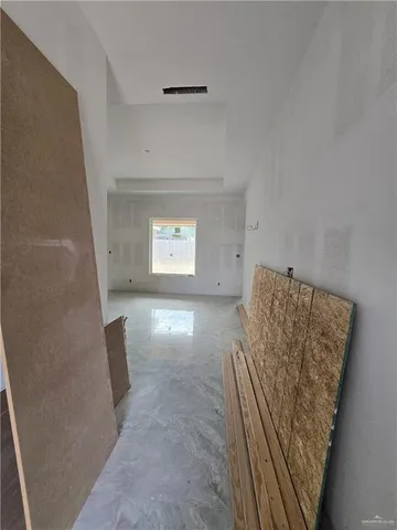 a view of an empty room and window