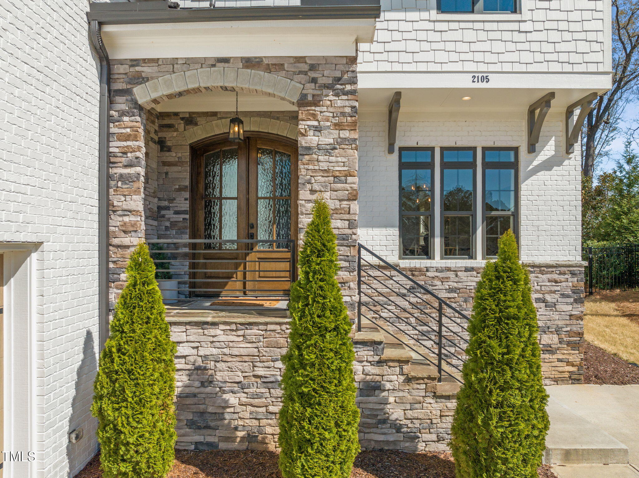 2105 Gardenbrook Drive Raleigh, NC 27606 - Photo 2 of 86 a front view of a house with garden