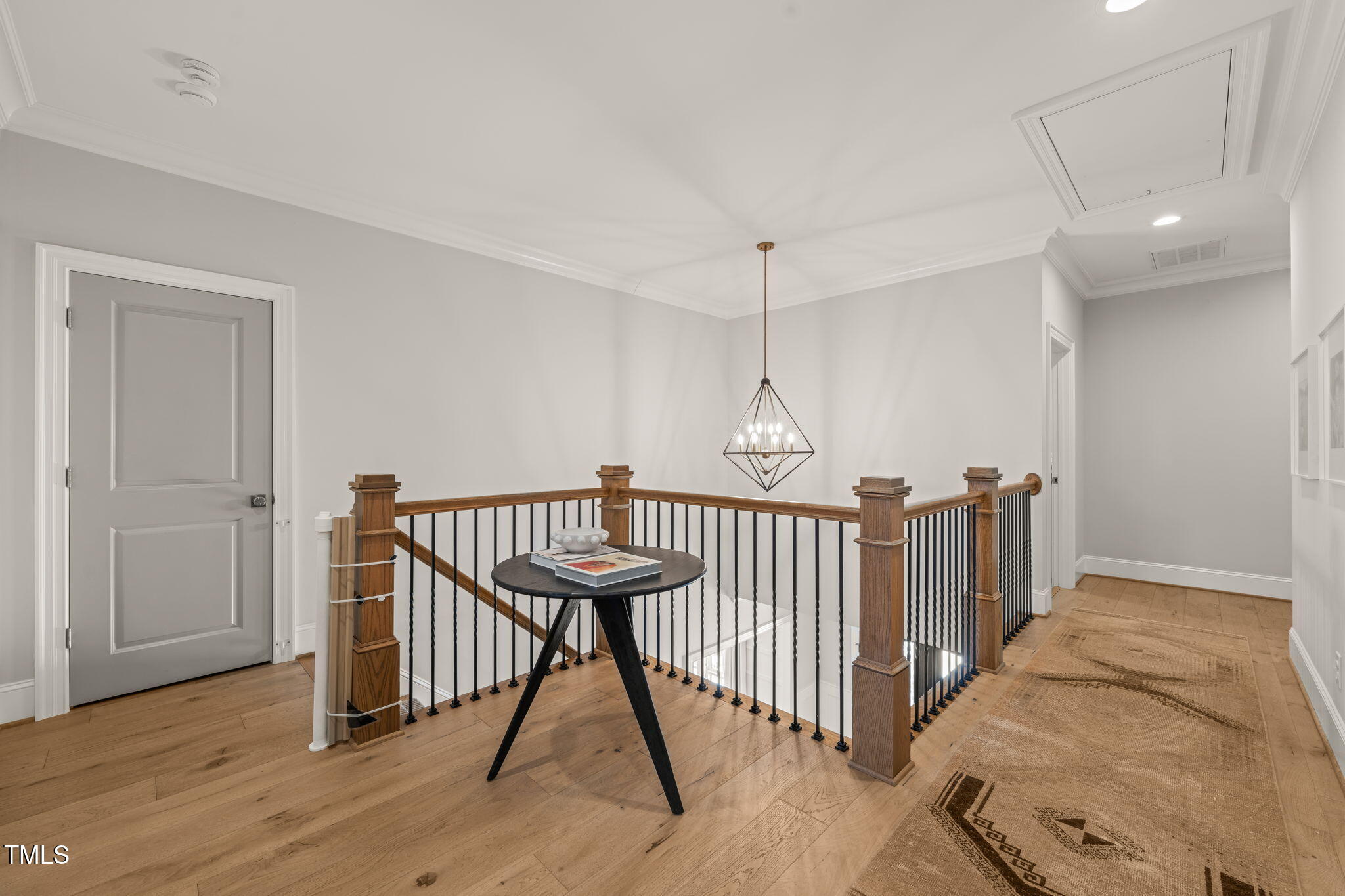 2105 Gardenbrook Drive Raleigh, NC 27606 - Photo 31 of 86 a view of a hallway with wooden floor and staircase