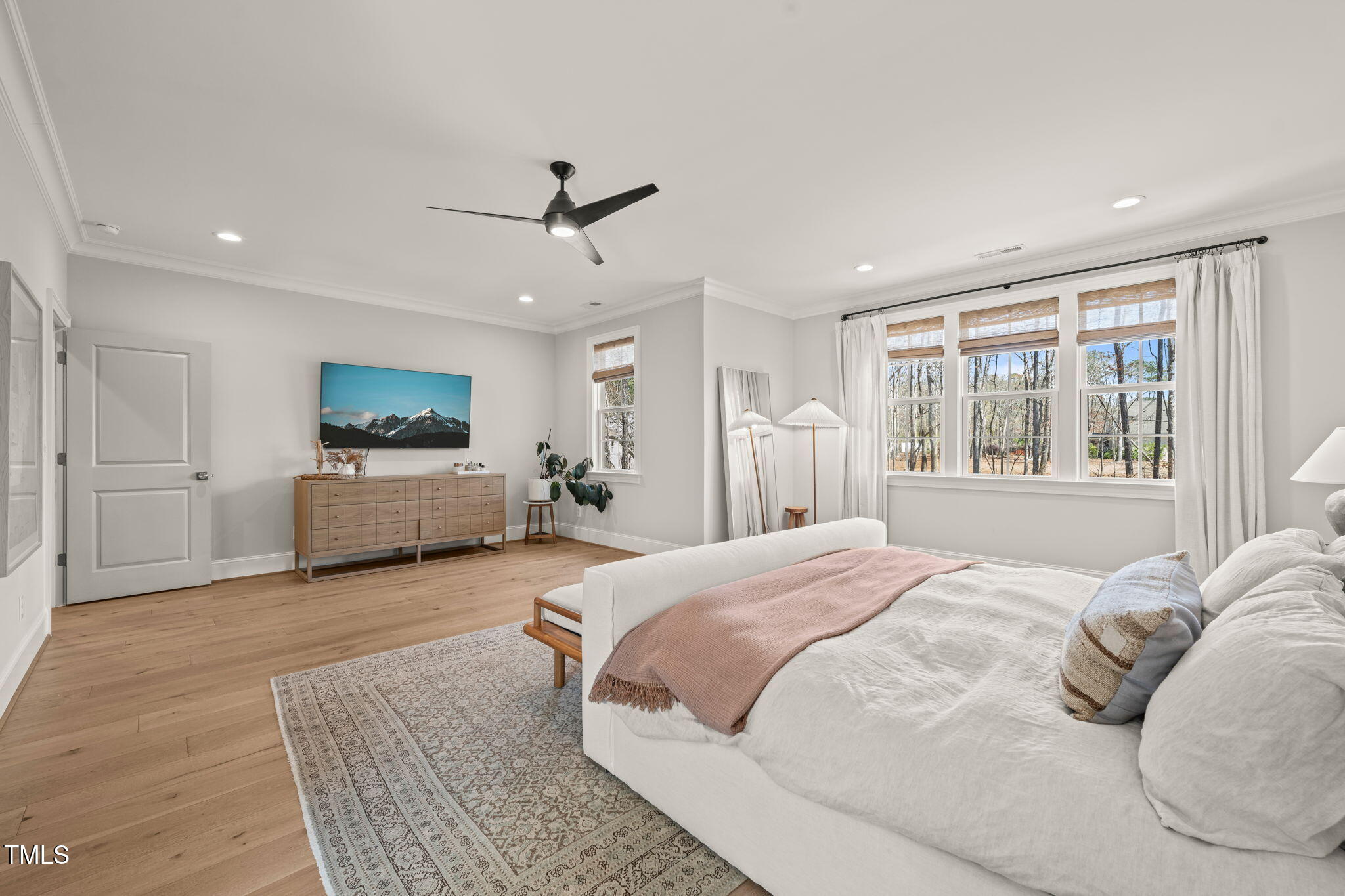 2105 Gardenbrook Drive Raleigh, NC 27606 - Photo 34 of 86 a spacious bedroom with a large bed and a window