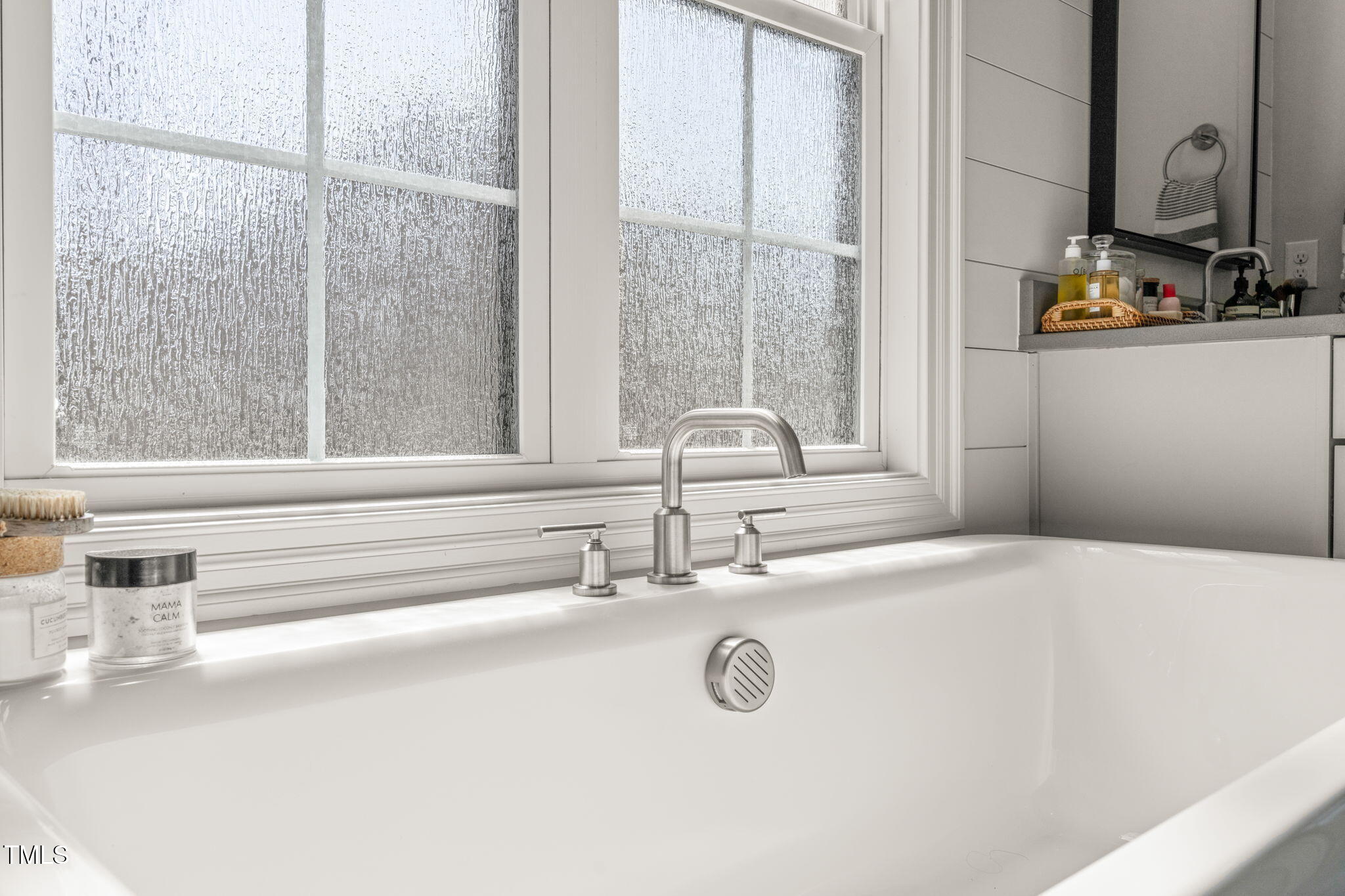 2105 Gardenbrook Drive Raleigh, NC 27606 - Photo 38 of 86 a bathroom with a sink and a mirror