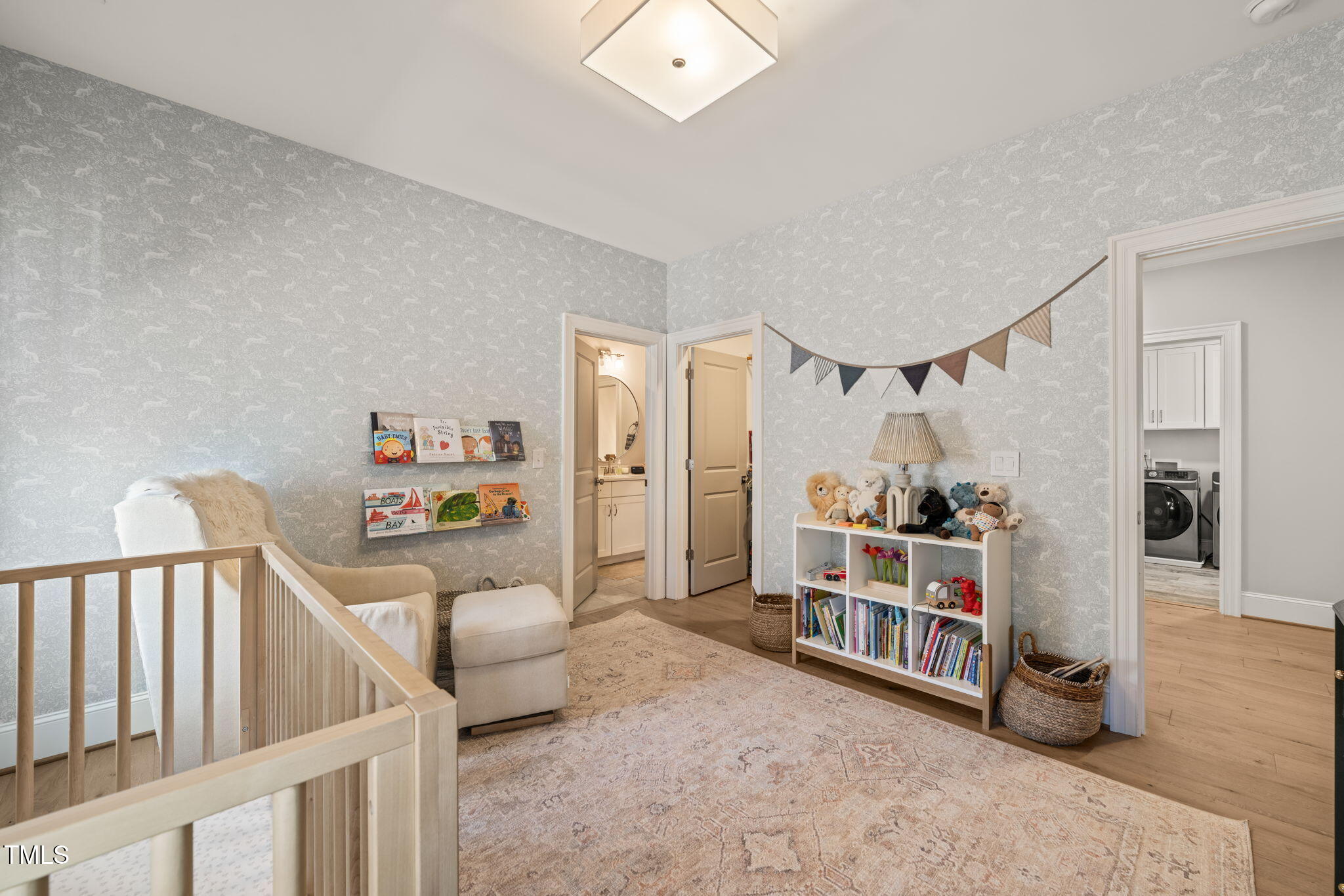 2105 Gardenbrook Drive Raleigh, NC 27606 - Photo 46 of 86 a living room with furniture and a baby crib
