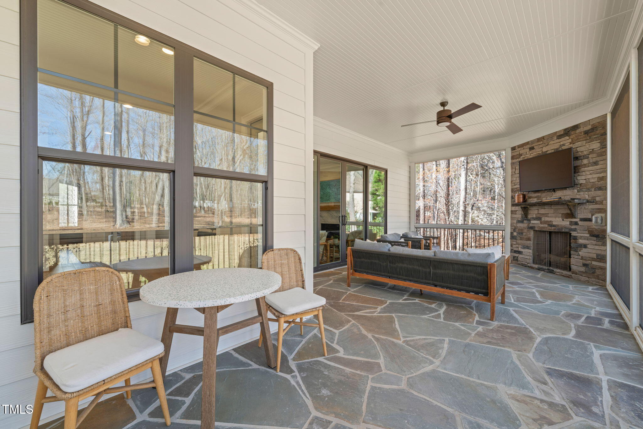 2105 Gardenbrook Drive Raleigh, NC 27606 - Photo 56 of 86 a living room with furniture and a floor to ceiling window