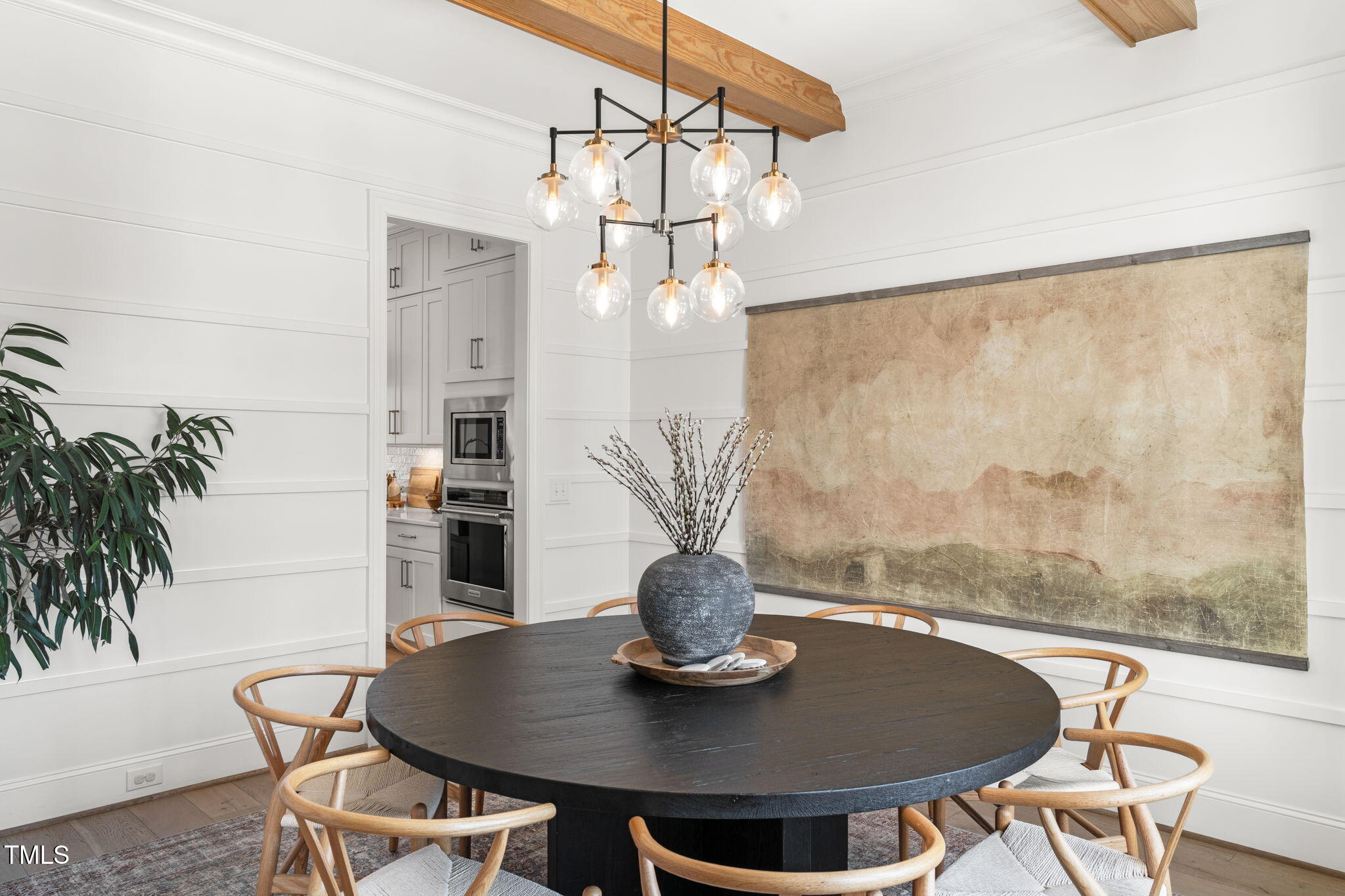 2105 Gardenbrook Drive Raleigh, NC 27606 - Photo 6 of 86 a view of a dining room with furniture wooden floor and a chandelier