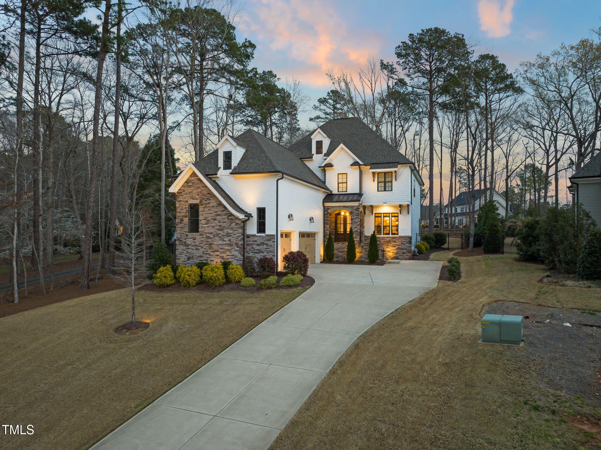 2105 Gardenbrook Drive Raleigh, NC 27606 - Photo 74 of 86 a front view of a house with a yard and garage