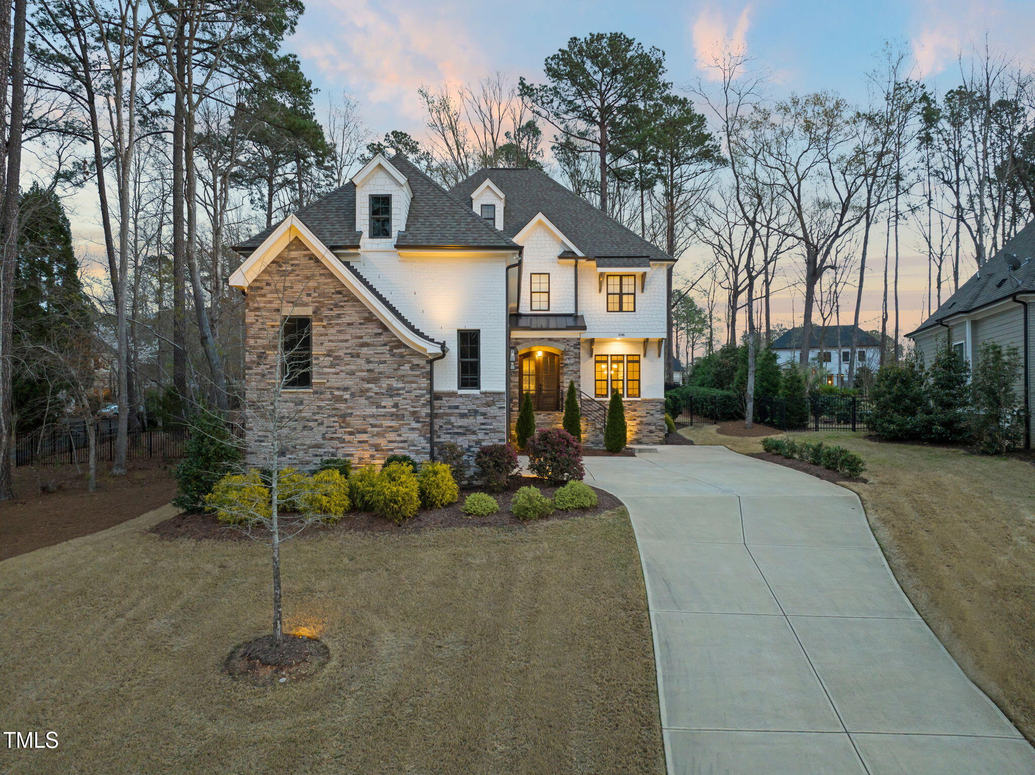 2105 Gardenbrook Drive Raleigh, NC 27606 - Photo 77 of 86 a front view of a house with garden