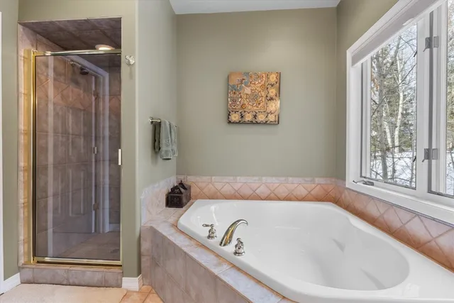 a view of a hallway with staircase and utility room