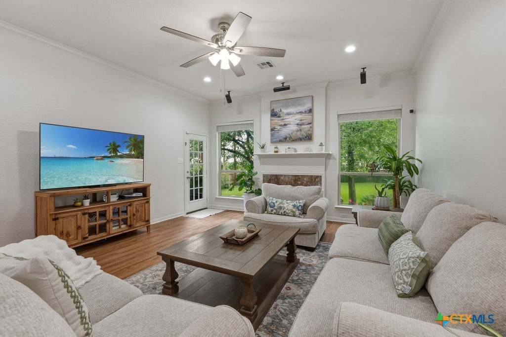 3306 Spring Canyon Road Belton, TX 76513 - Photo 12 of 40 a living room with furniture and a flat screen tv