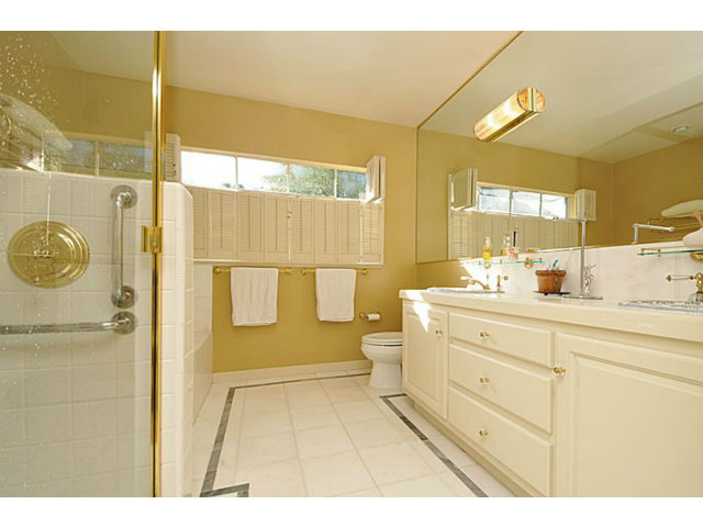 259 Bridge Road Hillsborough, CA 94010 - Photo 13 of 23 a bathroom with a sink mirror vanity and toilet