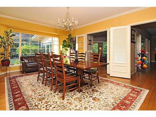 259 Bridge Road Hillsborough, CA 94010 - Photo 8 of 23 a view of a dining room with furniture wooden floor and chandelier