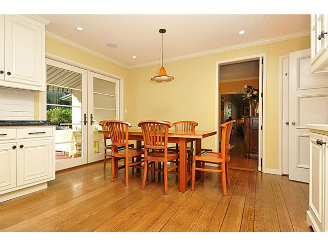259 Bridge Road Hillsborough, CA 94010 - Photo 9 of 23 a dining room with furniture a chandelier and wooden floor