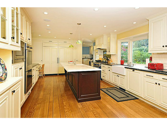 259 Bridge Road Hillsborough, CA 94010 - Photo 10 of 23 a large kitchen with stainless steel appliances kitchen island granite countertop a large counter top a stove and a sink