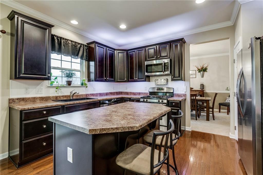 2018 Eagle Ridge Drive Valencia, PA 16059 - Photo 2 of 25 The equipped kitchen offers plenty of counter space, stainless steel appliances, under and over cabinet lighting, and hardwood floors.