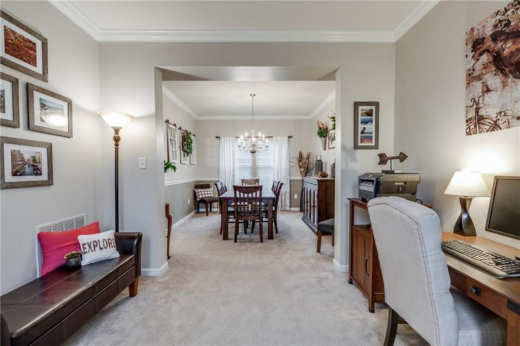 2018 Eagle Ridge Drive Valencia, PA 16059 - Photo 8 of 25 The living room and dining room offer plenty of light, beautiful crown molding and neutral paint and carpet.