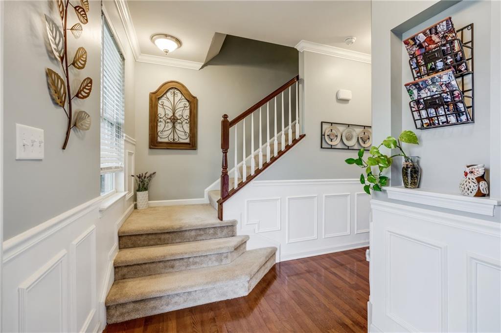 2018 Eagle Ridge Drive Valencia, PA 16059 - Photo 9 of 25 The inviting entry features hardwood floors and wainscoting adds to the charm!