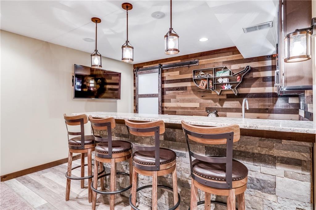 2018 Eagle Ridge Drive Valencia, PA 16059 - Photo 10 of 25 Beautiful CUSTOM bar in the huge finished basement! There is a storage room located through the barn door.