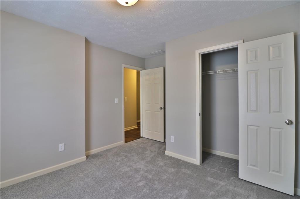 353 Fall View Court Winder, GA 30680 - Photo 44 of 61 an empty room with closet and a bathroom
