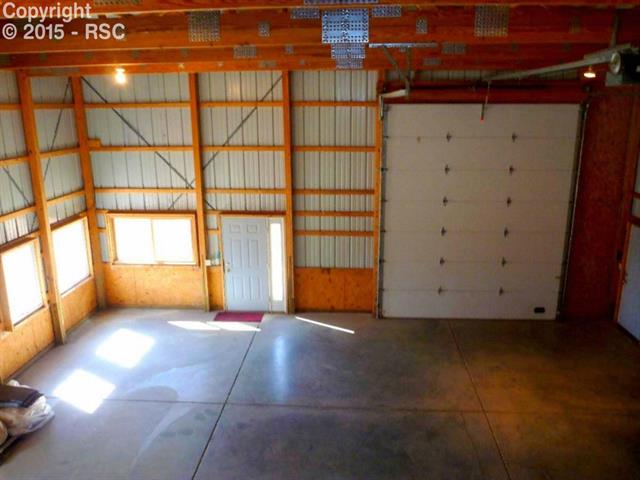 1095 Doe Valley Road Guffey, CO 80820 - Photo 7 of 21 Looking down from stair landing when the shop was empty.