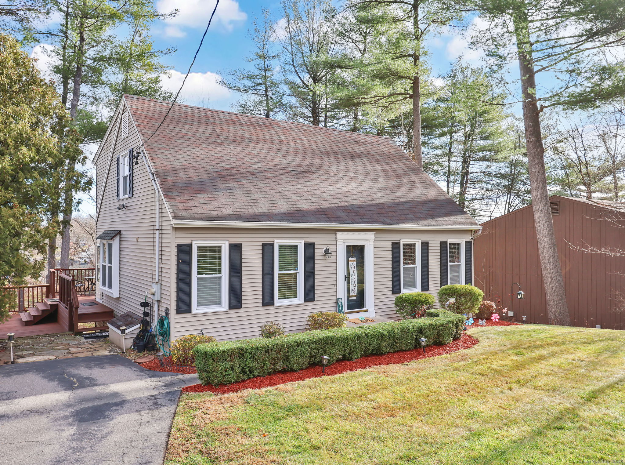 a front view of a house with garden