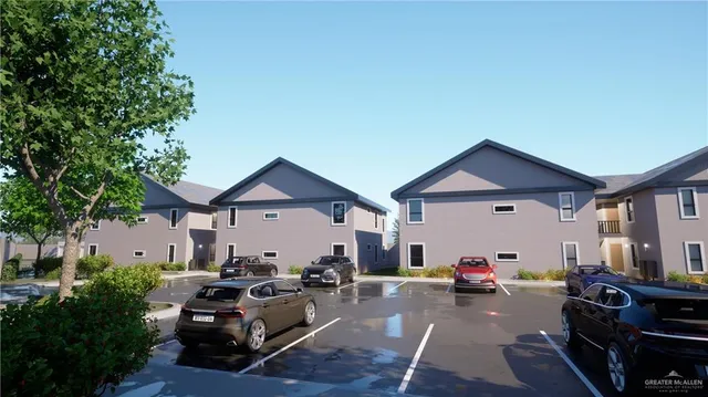 a view of a patio with couches and a fire pit