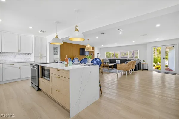 a kitchen view with living room and living room view