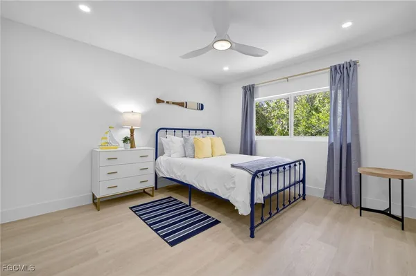 a bedroom with furniture and windows