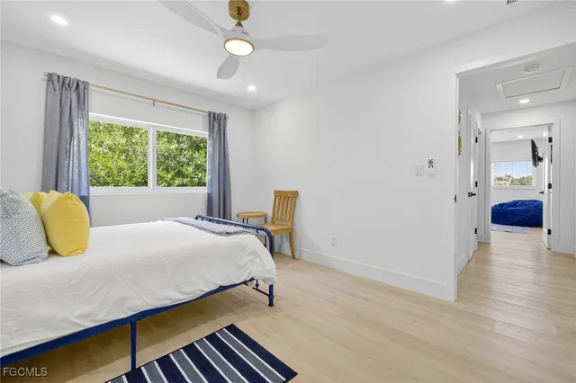 a bedroom with a bed and a table