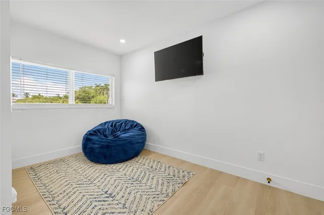 a living room with a couch and a flat screen tv