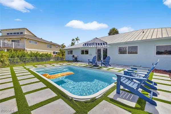 a aerial view of a house with swimming pool and porch