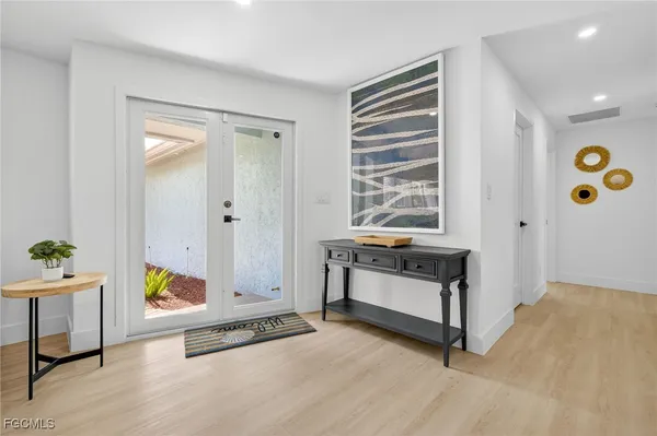 a spacious bedroom with a bed and a window