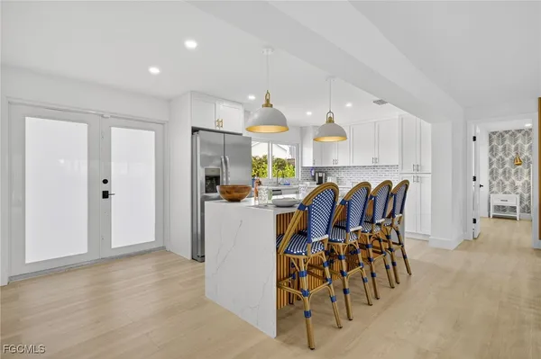 a view of a kitchen and dining room