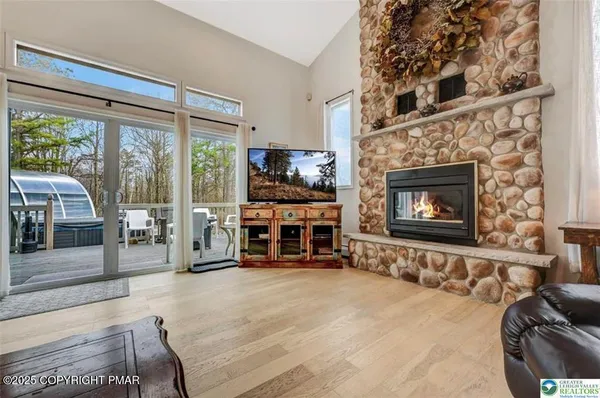 a kitchen with stainless steel appliances granite countertop a stove a sink and a white cabinets