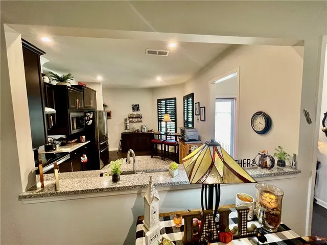 a kitchen with a stove and a table