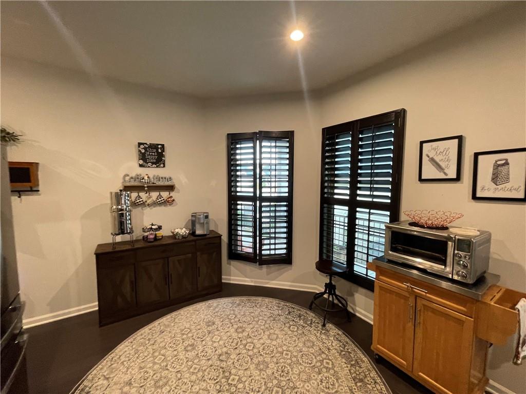 5709 Grapewood Street Hoschton, GA 30548 - Photo 14 of 65 a bedroom with furniture and a window