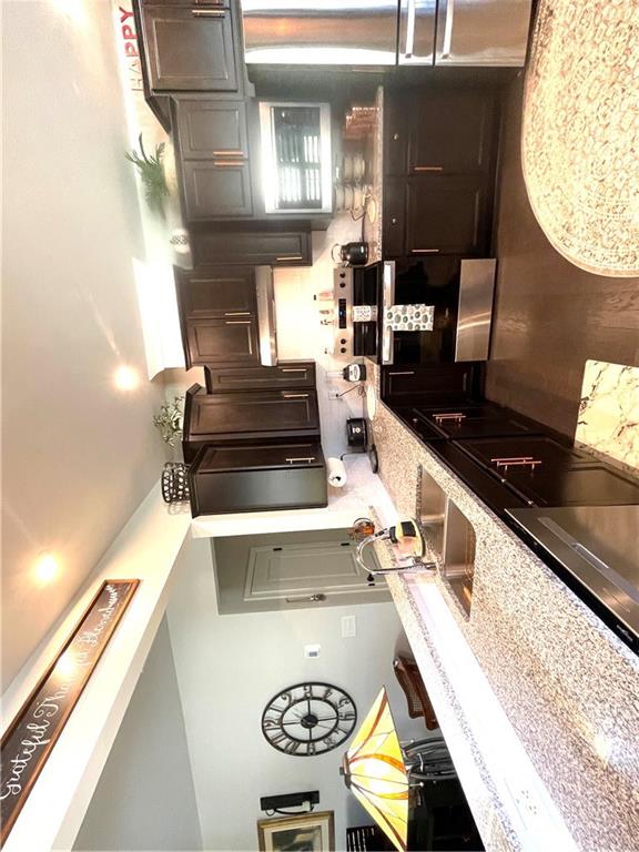 5709 Grapewood Street Hoschton, GA 30548 - Photo 19 of 65 a kitchen with a stove and a table