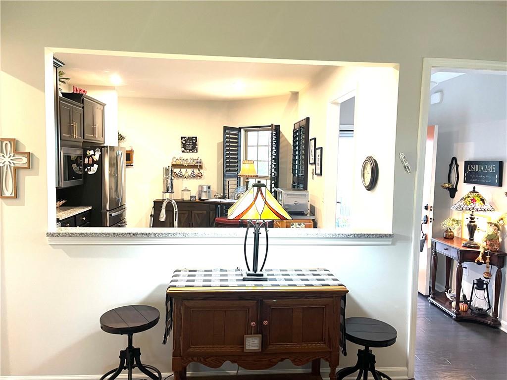5709 Grapewood Street Hoschton, GA 30548 - Photo 29 of 65 a living room with furniture and a window