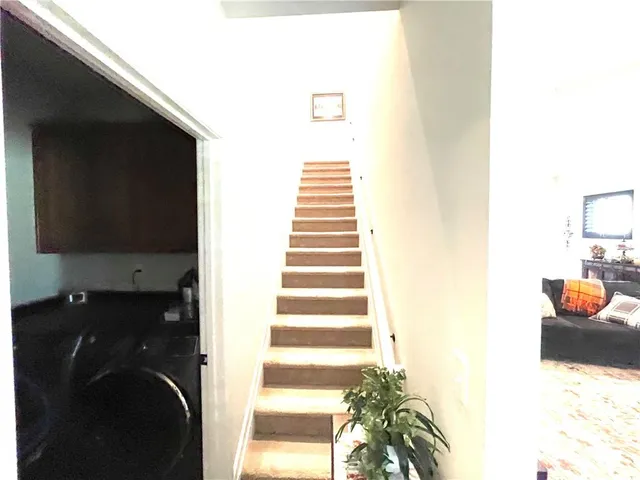 a bedroom with a bed and a television