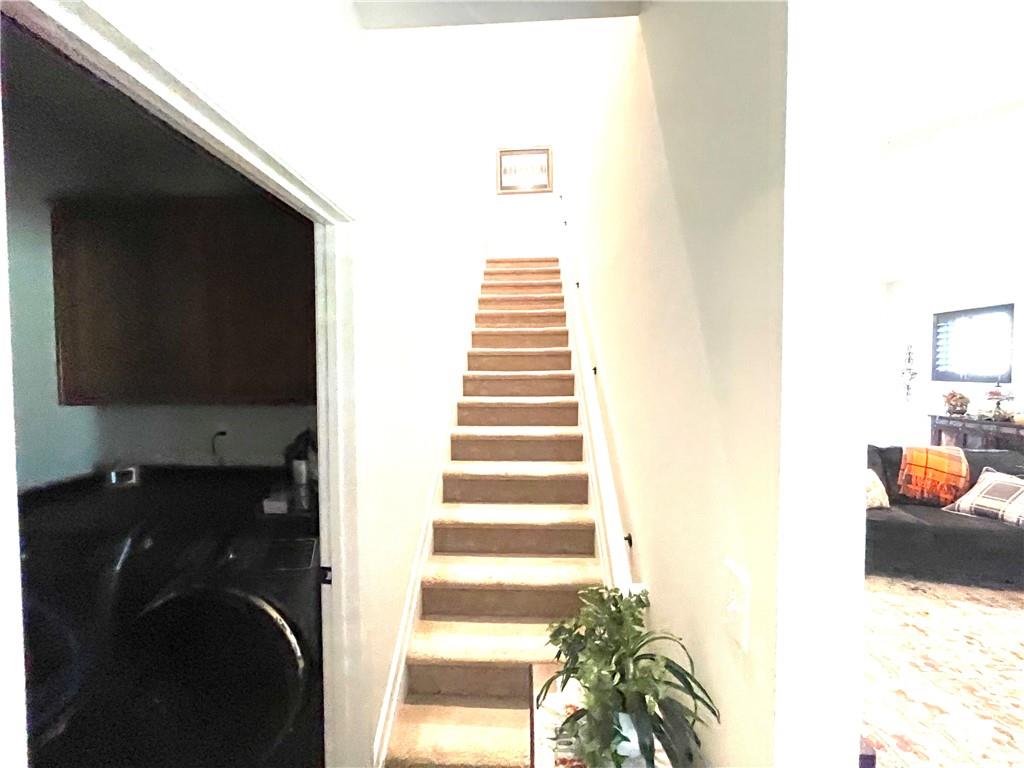 5709 Grapewood Street Hoschton, GA 30548 - Photo 39 of 65 a view of entryway and hall with wooden floor