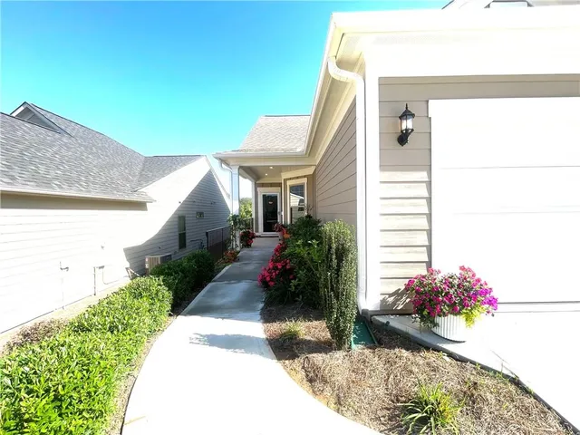 a view of a backyard with potted plants