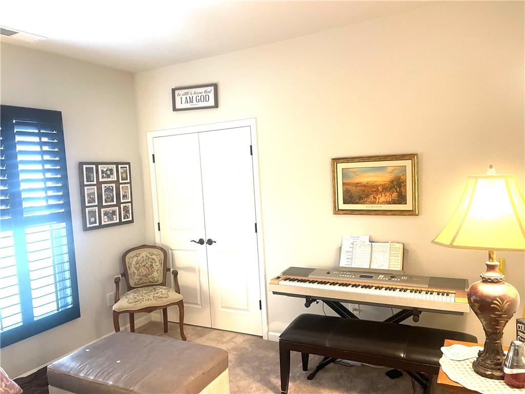 5709 Grapewood Street Hoschton, GA 30548 - Photo 41 of 65 a workspace with furniture and a piano