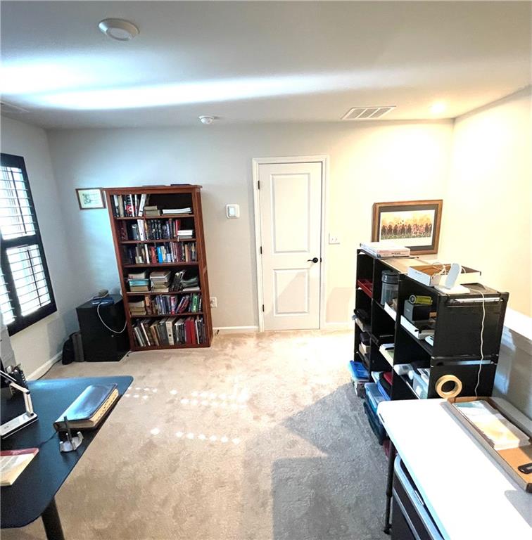 5709 Grapewood Street Hoschton, GA 30548 - Photo 44 of 65 a room with furniture and window