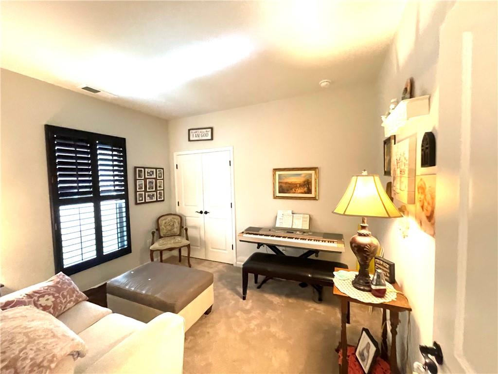 5709 Grapewood Street Hoschton, GA 30548 - Photo 59 of 65 a bedroom with a bed and a window